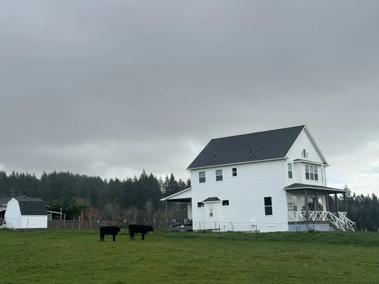 White farmhouse built by First Choice Homes